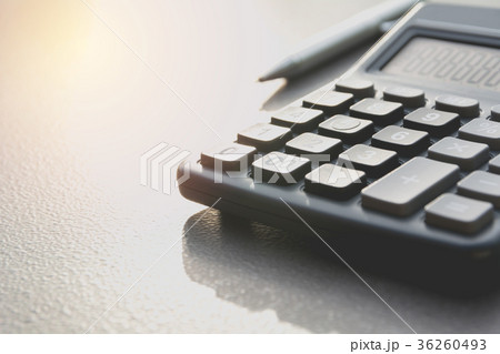 Close up of black calculator with pen Close up of black calculator with pen 36260493