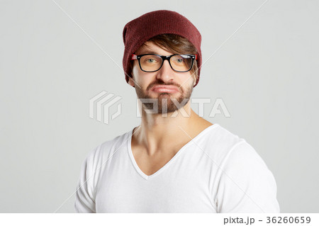 Handsome young man posing at studio Handsome young man posing at studio 36260659