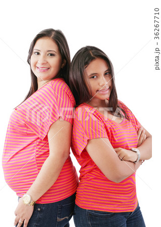 hispanic pregnant woman with her daughter 36267710