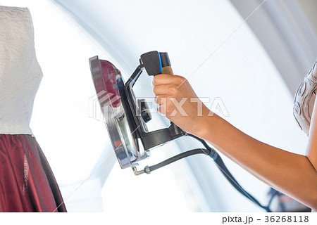 Woman holding iron Woman holding iron 36268118
