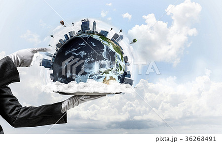 Hand of waitress presenting Earth globe on tray. Hand of waitress presenting Earth globe on tray. 36268491