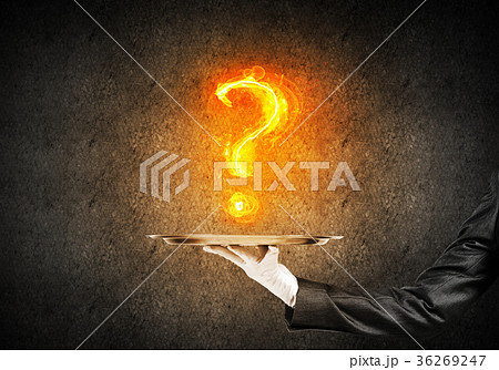 Hand of waitress presenting flaming question mark 36269247