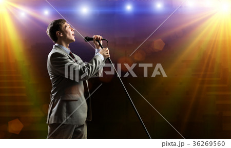 Businessman with microphone 36269560