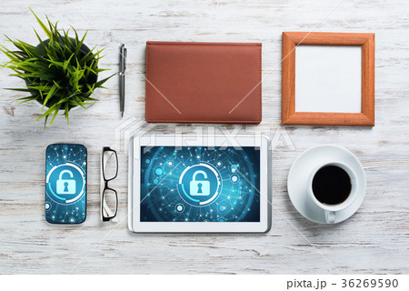 Web security and technology concept with tablet pc on wooden table 36269590