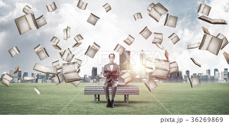 Young businessman or student studying the science in summer park 36269869