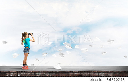 Concept of careless happy childhood with girl of school age looking in future Concept of careless happy childhood with girl of school age looking in future 36270243