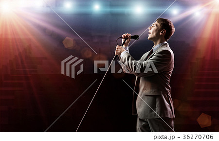Businessman with microphone 36270706