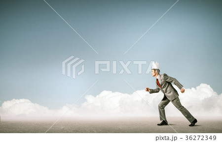 King businessman in elegant suit running and blue cityscape silh 36272349