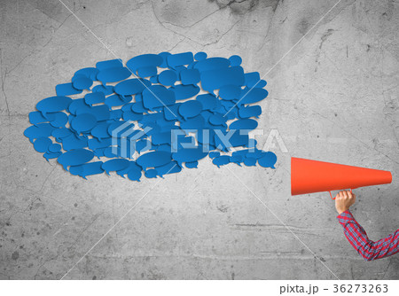 Hand of woman holding green paper trumpet and speech cloud coming out Hand of woman holding green paper trumpet and speech cloud coming out 36273263