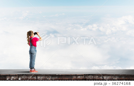 Concept of careless happy childhood with girl of school age looking in future 36274168