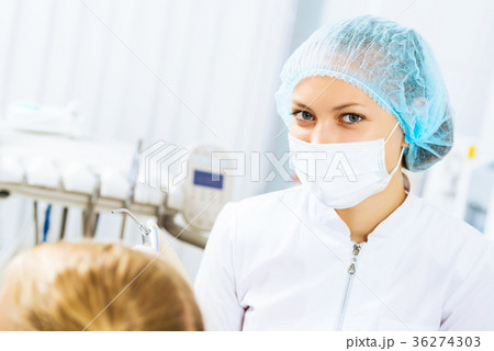 Dentist inspecting patient 36274303