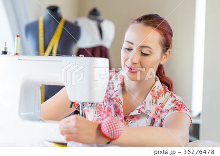 Seamstress at work 36276478