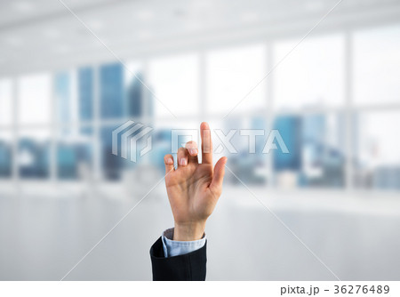 Choosing gesture of businessperson in elegant modern interior in sunshine light 36276489