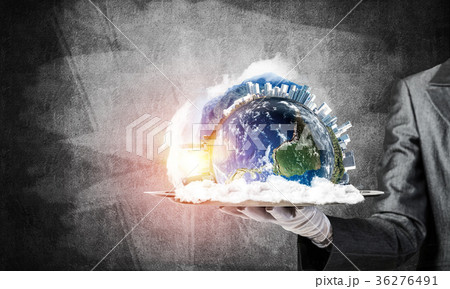 Hand of waitress presenting Earth globe on tray. Hand of waitress presenting Earth globe on tray. 36276491