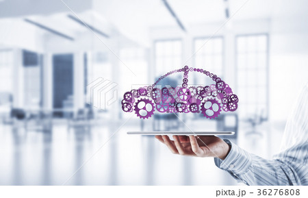 Close of businessman holding tablet pc with car icon on screen 36276808