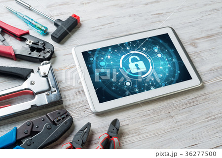 Web security and technology concept with tablet pc on wooden table Web security and technology concept with tablet pc on wooden table 36277500
