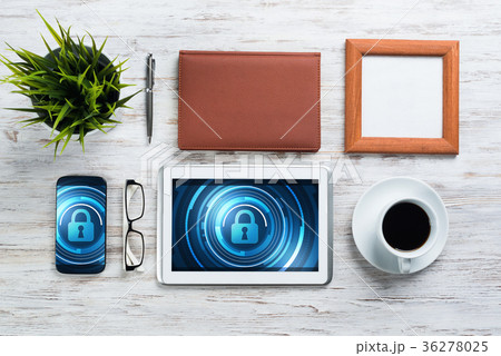 Web security and technology concept with tablet pc on wooden table Web security and technology concept with tablet pc on wooden table 36278025