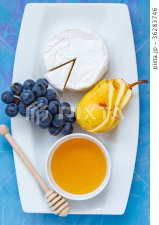 Cheese brie (camembert) with honey and fruits  36283746