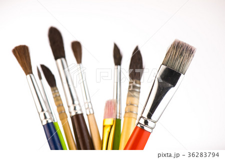 Paint brushes in a jar on whith background 36283794