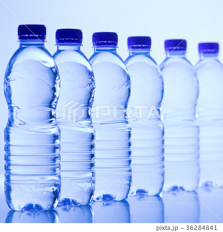 Plastic bottles of water isolated on blue Plastic bottles of water isolated on blue 36284841