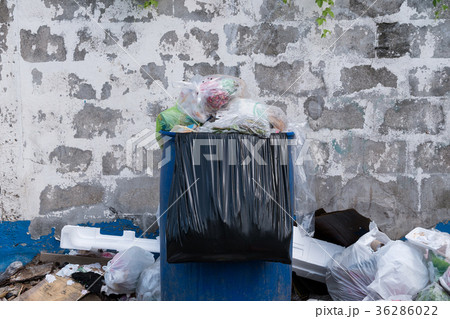 Dumpsters being full with garbage in the evening Dumpsters being full with garbage in the evening 36286022