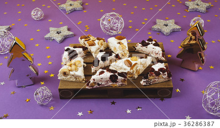 Traditional italian festive torrone or nougat. Traditional italian festive torrone or nougat. 36286387