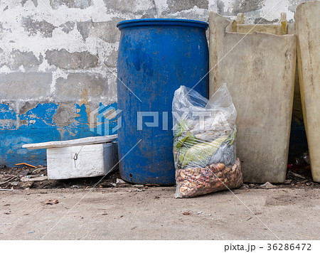 Garbage bags with food waste at dumpsters Garbage bags with food waste at dumpsters 36286472