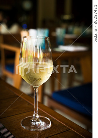 Glass with cold white wine at restaurant Glass with cold white wine at restaurant 36287421