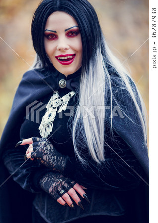 Photo of licking vampire woman with long hair, red Photo of licking vampire woman with long hair, red 36287938