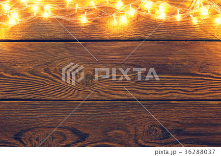 Picture of wooden surface with burning garland on Picture of wooden surface with burning garland on 36288037