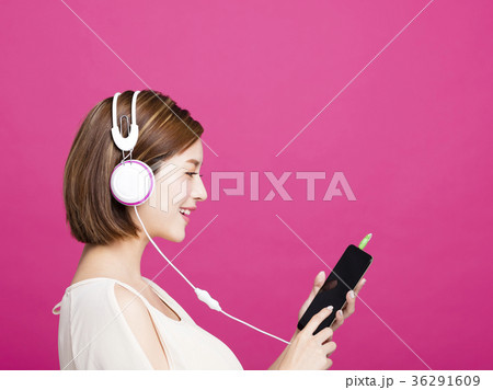 woman listening music with headphones  36291609