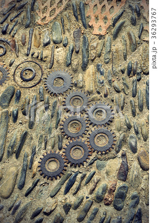 Floor with pattern from pebbles and metal details Floor with pattern from pebbles and metal details 36293767