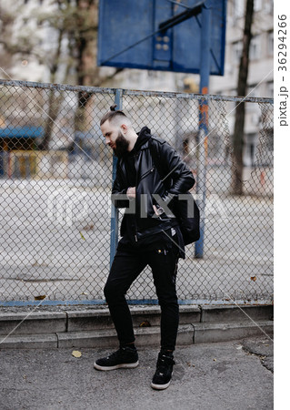 Modern young bearded man in black style clothes 36294266