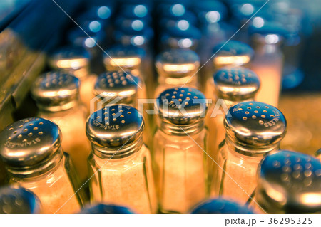 rows of traditional style salt shakers 36295325