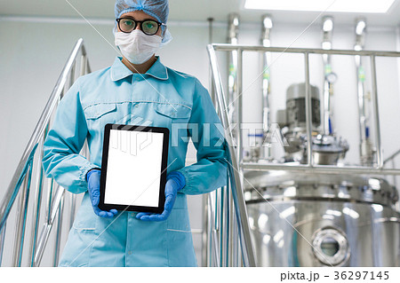 Engineer in the production of a tablet in hands 36297145