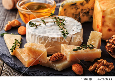 Cheese, nuts, honey and red wine. Cheese, nuts, honey and red wine. 36297633