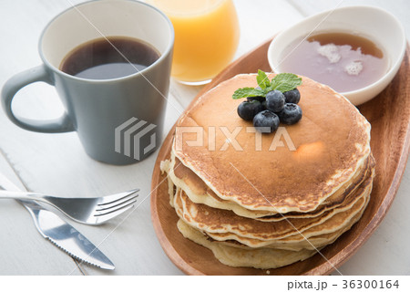 isolated blue berry pancake with syrup and drink isolated blue berry pancake with syrup and drink 36300164