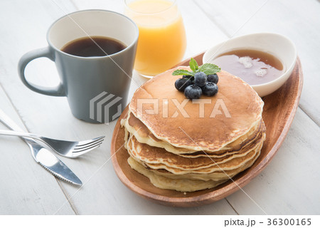 isolated blue berry pancake with syrup and drink isolated blue berry pancake with syrup and drink 36300165
