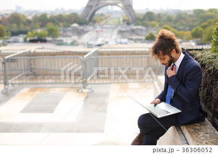 Mixed blood businessman working with laptop near Mixed blood businessman working with laptop near 36306052