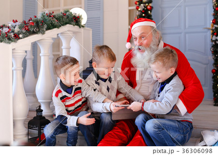 Father Christmas joking with naughty boy. Father Christmas joking with naughty boy. 36306098