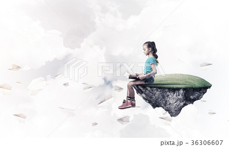 Concept of careless happy childhood with girl reading book 36306607