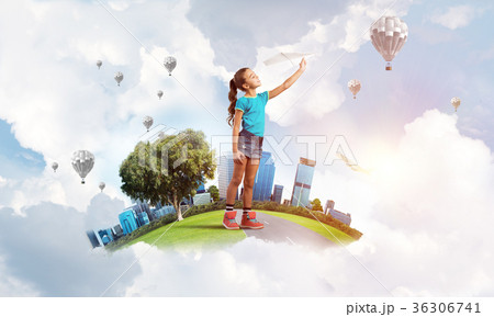Concept of careless happy childhood with girl dreaming about future 36306741
