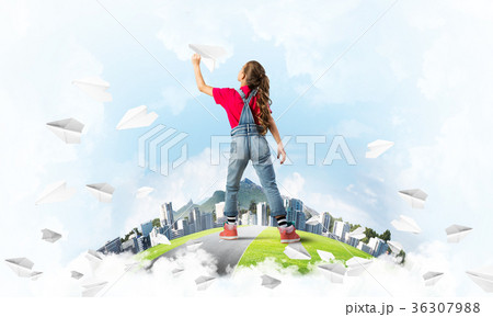 Concept of careless happy childhood with girl dreaming about future 36307988