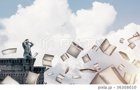 Young man sitting on top and dont want to hear anything 36308010