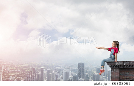 Concept of careless happy childhood with girl showing touch gesture 36308065