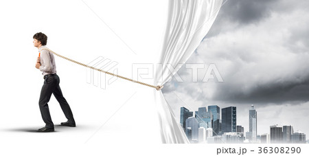 Young man opening white curtain and presenting modern city landscape Young man opening white curtain and presenting modern city landscape 36308290