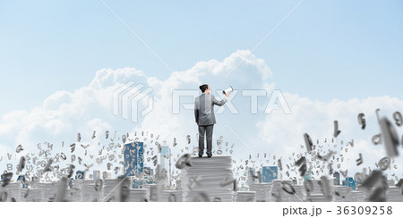 Businessman standing with megaphone. Businessman standing with megaphone. 36309258