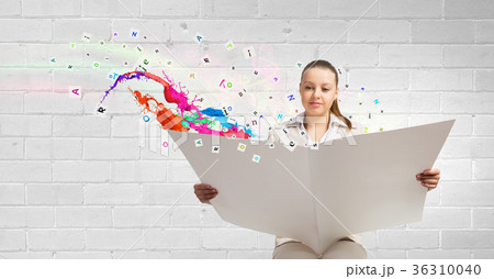 Woman reading newspaper Woman reading newspaper 36310040