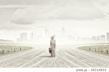 Woman with old suitcase Woman with old suitcase 36310834