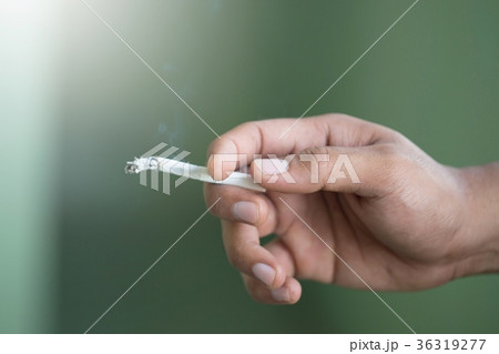 peel it off Cigarette pack smoking a cigarette  36319277